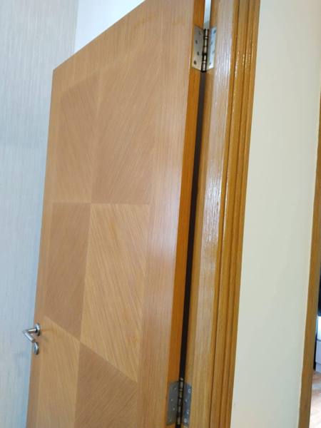 Chevron veneer door varnished