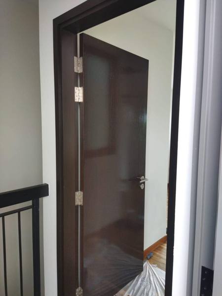 Dark bedroom door varnished