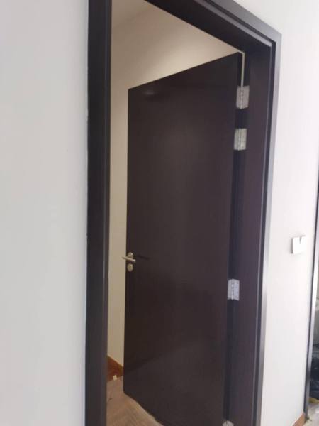 Dark door and frame varnished