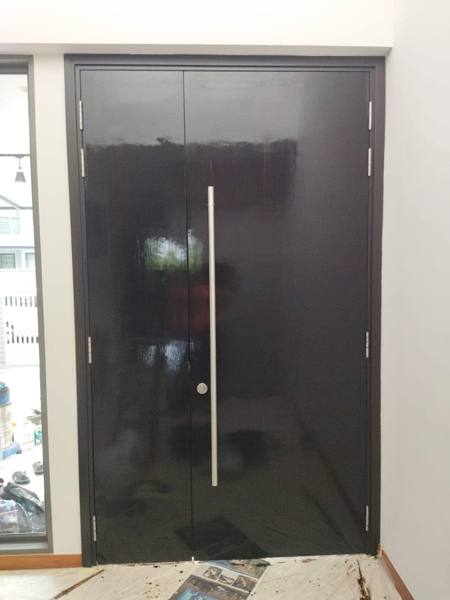 Dark double main door after varnishing