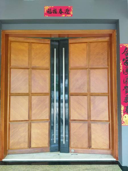 Double teak main door after restoration