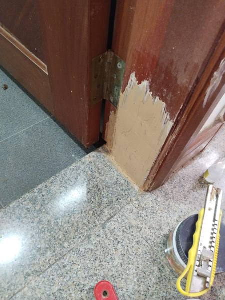 Water-damaged HDB toilet door frame